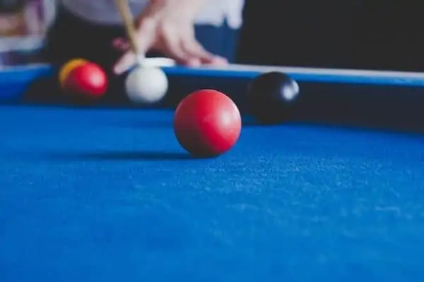 Person Playing Blackball Pool