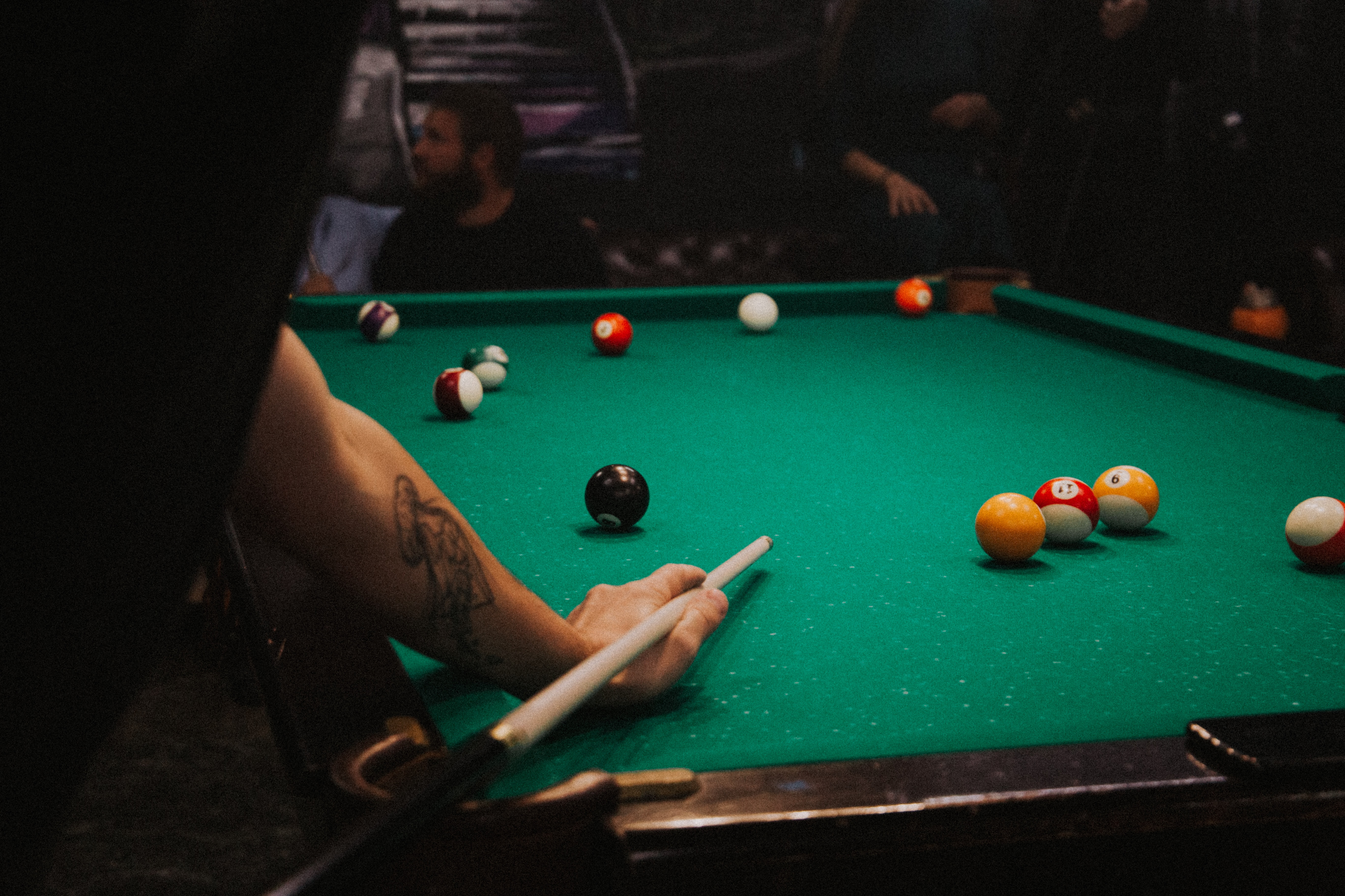 Billiards player lining up a shot